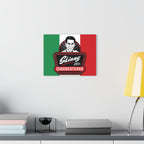 Canvas print of a logo with a man's face on a table with books and a lamp.