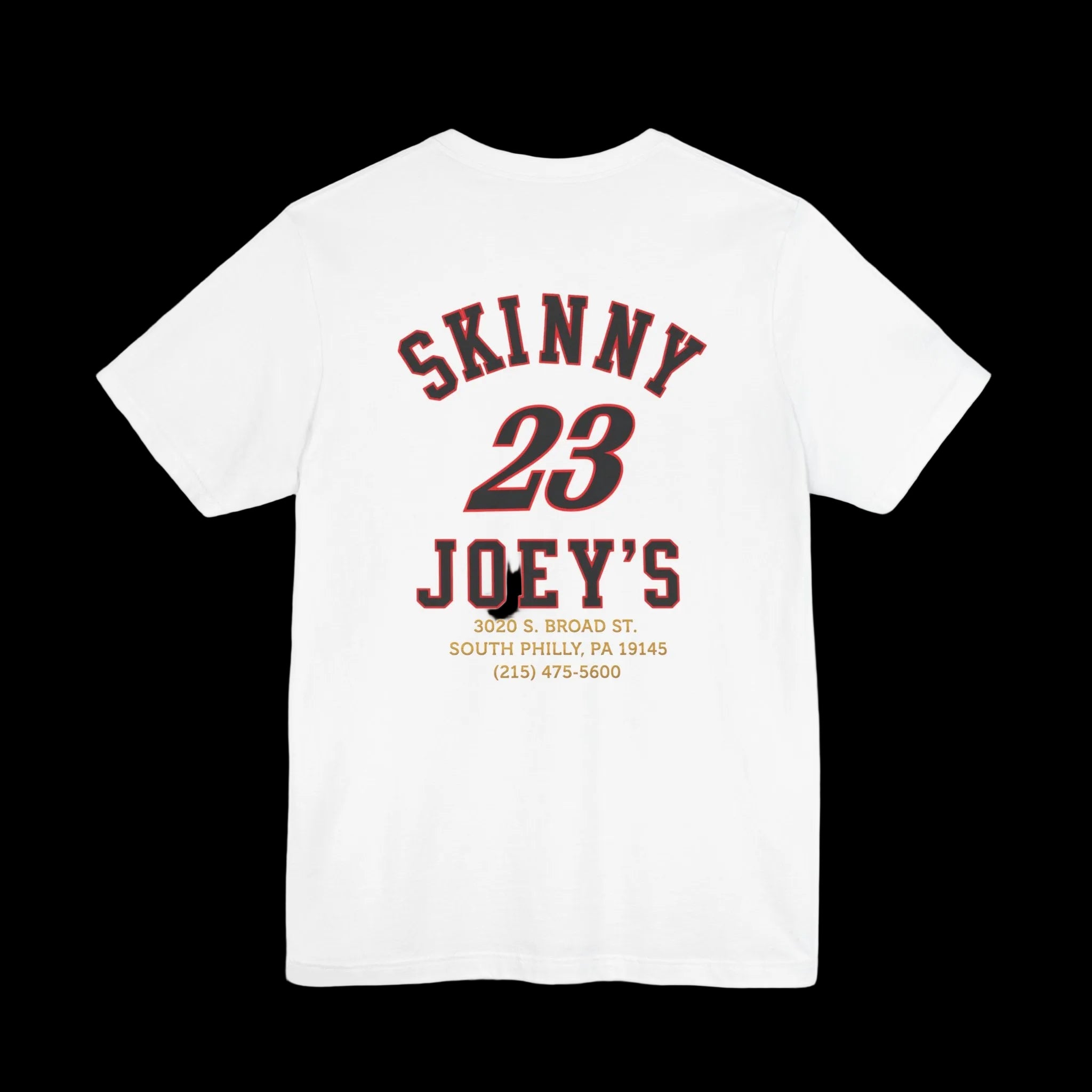 A white short-sleeve t-shirt shown from the back, featuring a dark red and black graphic print that reads 'SKINNY 23 JOEY'S' with smaller address and phone text below.