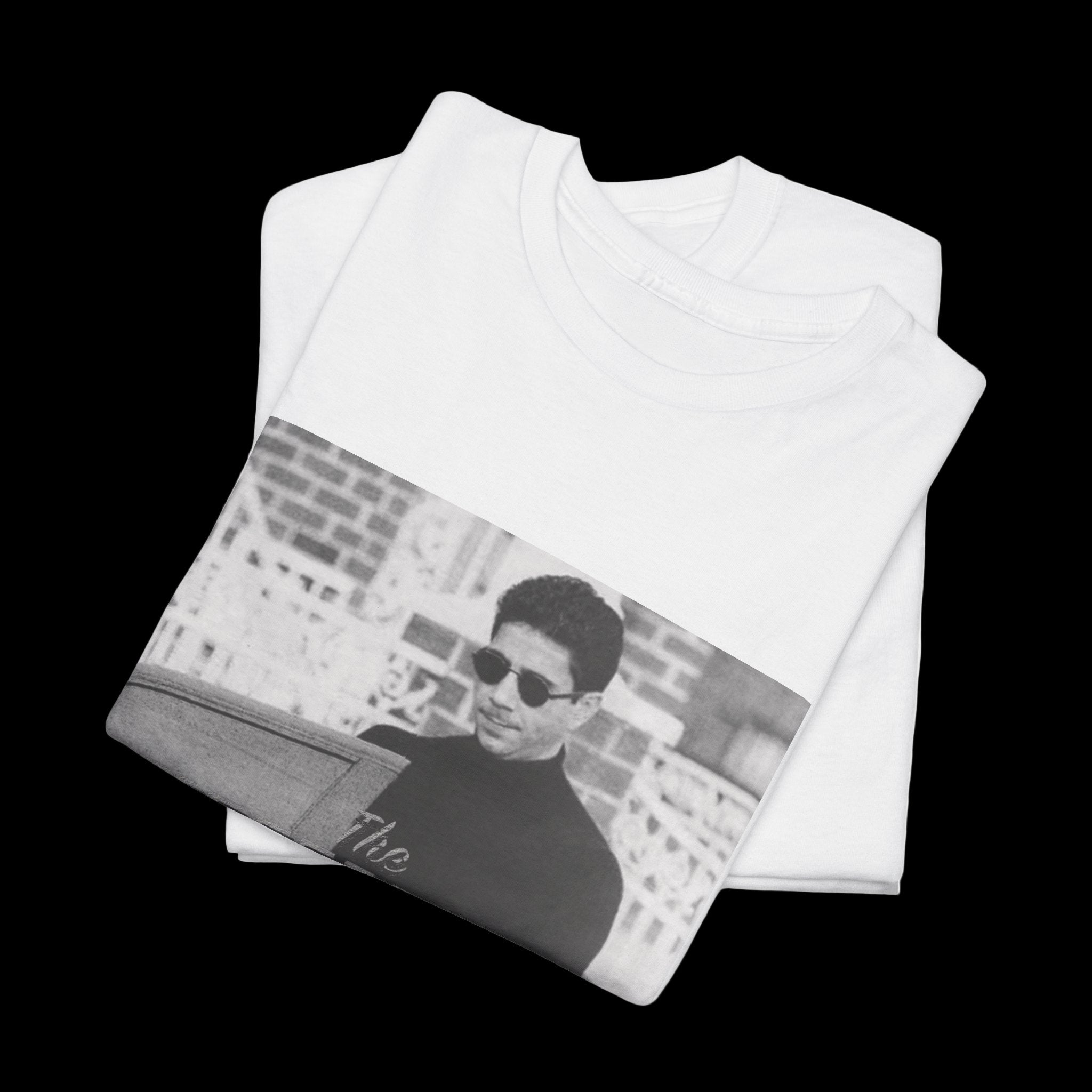 White t-shirt with a graphic of a person wearing sunglasses on a white background