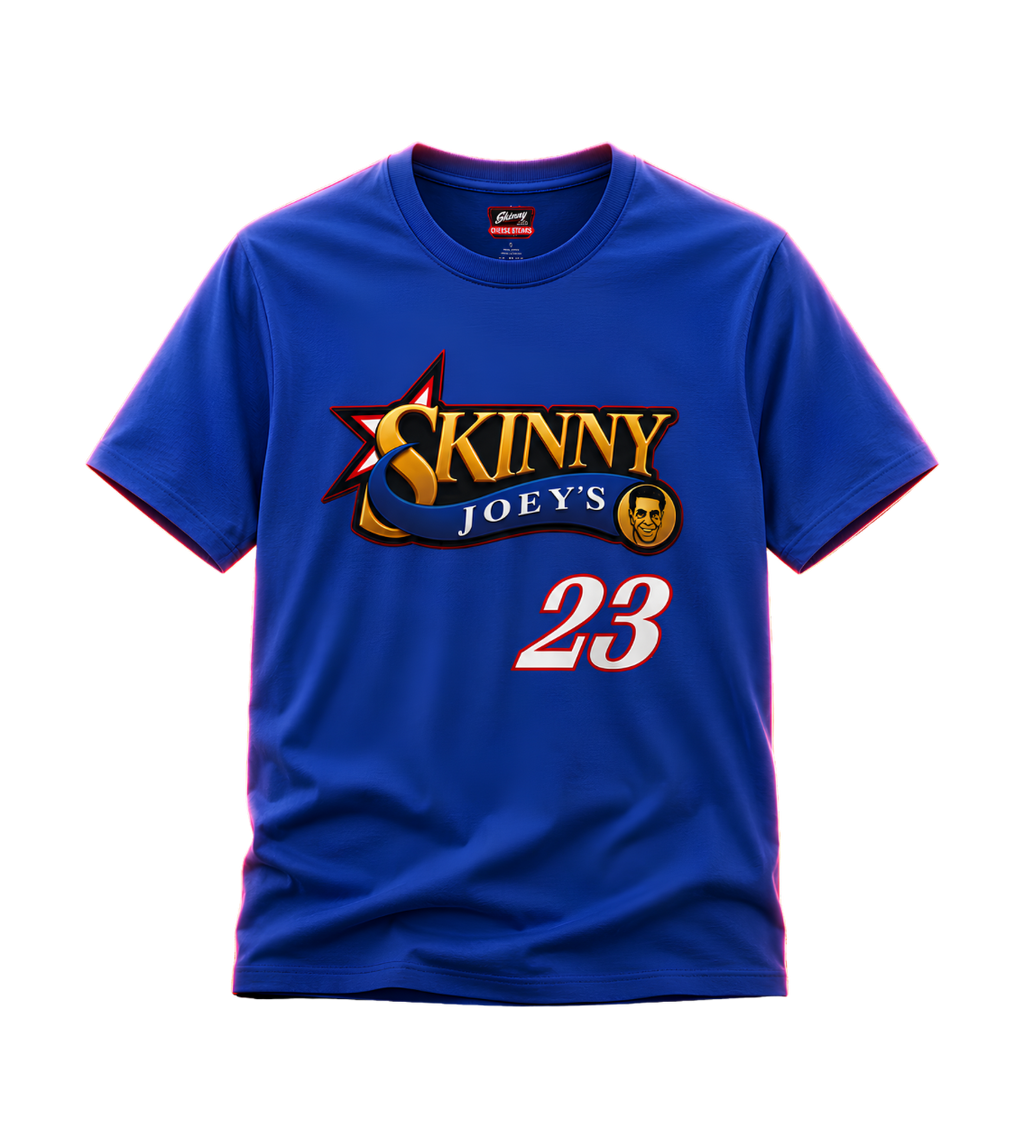 A royal blue short-sleeve t-shirt with a graphic on the chest reading 'SKINNY JOEYS' in gold and white, with a star and scroll design, and the number '23' below in white with a red outline. A small red and white Nike logo is visible inside the collar.