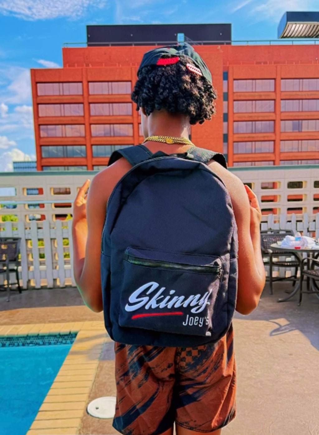 Skinny Joey's classic backpack in navy, worn poolside, South Philly