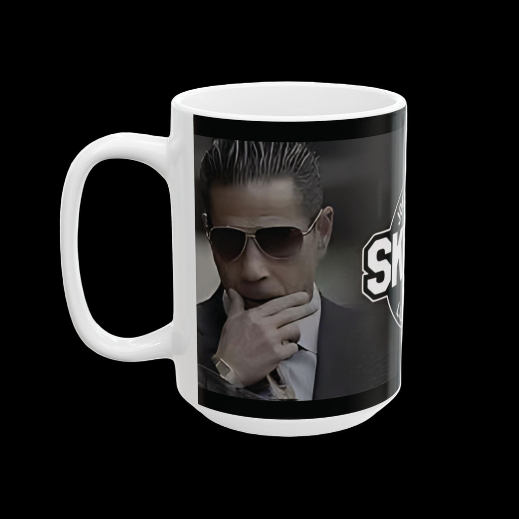 Mug with a graphic of a person in a suit and sunglasses on a black background, featuring the word 'SHARKS'.