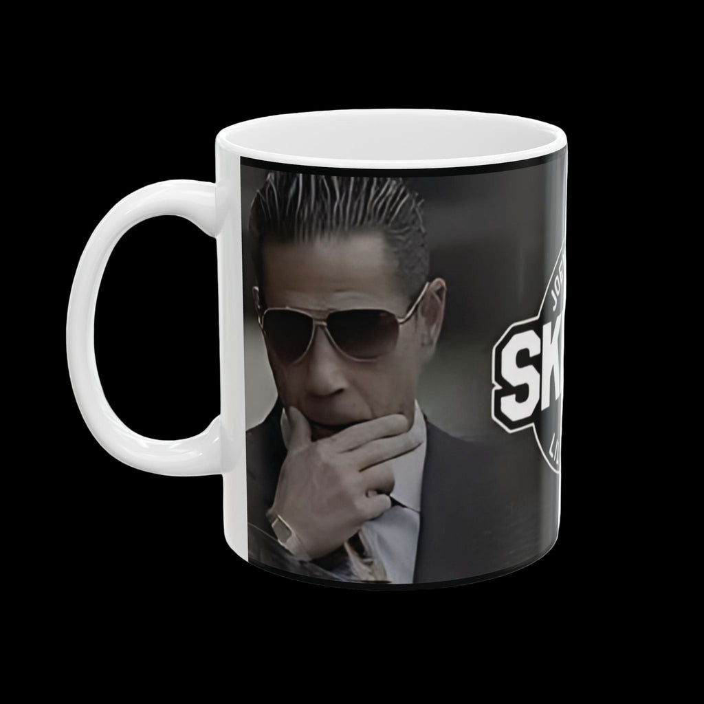 Mug with a graphic of a person in a suit and sunglasses, featuring the word 'SKY'.