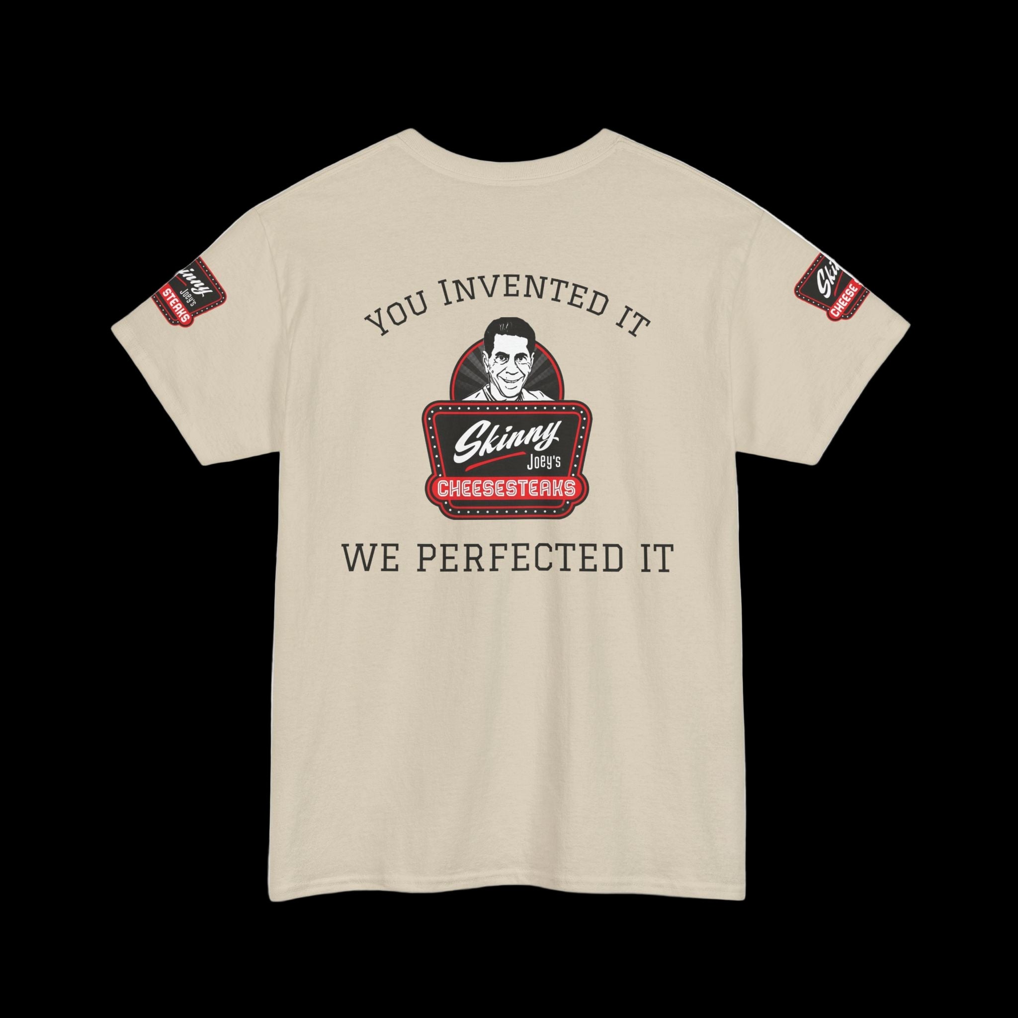 Beige t-shirt with graphic design and text on a white background