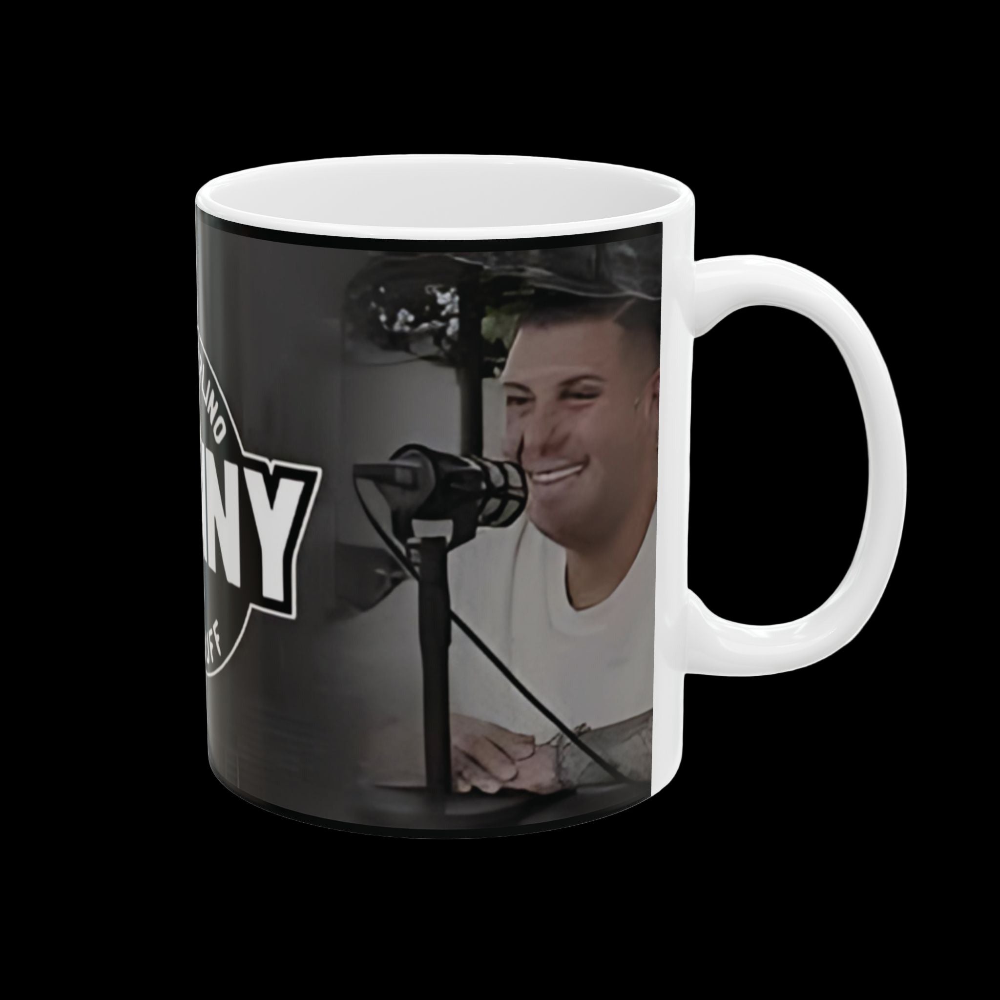 Mug with a person smiling and a microphone on a dark background