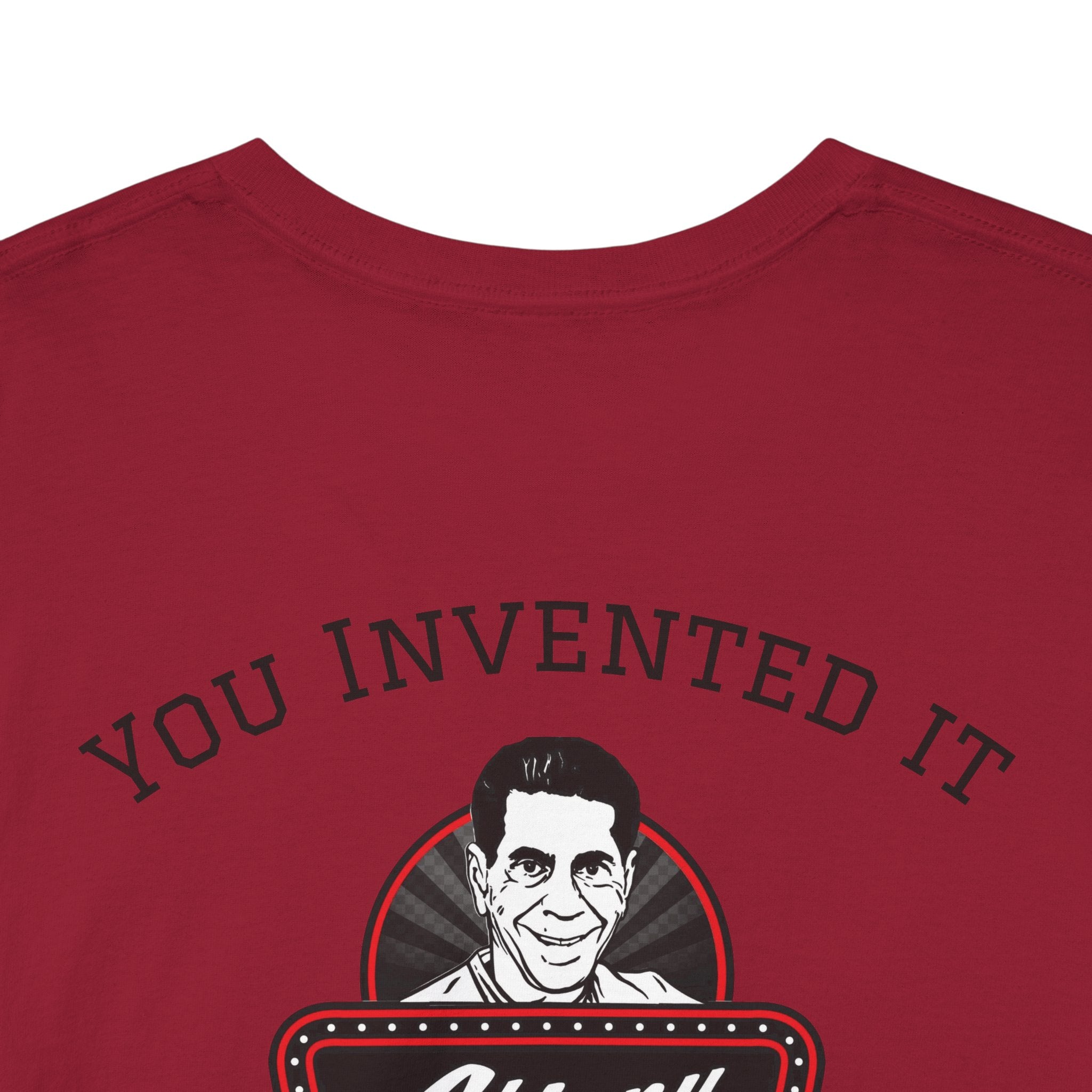 Red t-shirt with a graphic of a man's face and 'YOU INVENTED IT' text on a white background