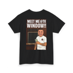 Black t-shirt with a graphic of a person holding money and text 'Meet Me @ The Window!!!' on a white background