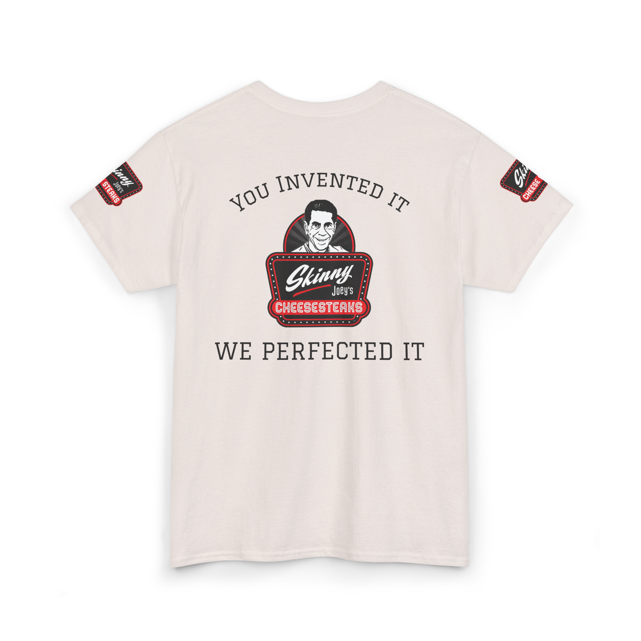 Beige t-shirt with graphic design and text on a white background