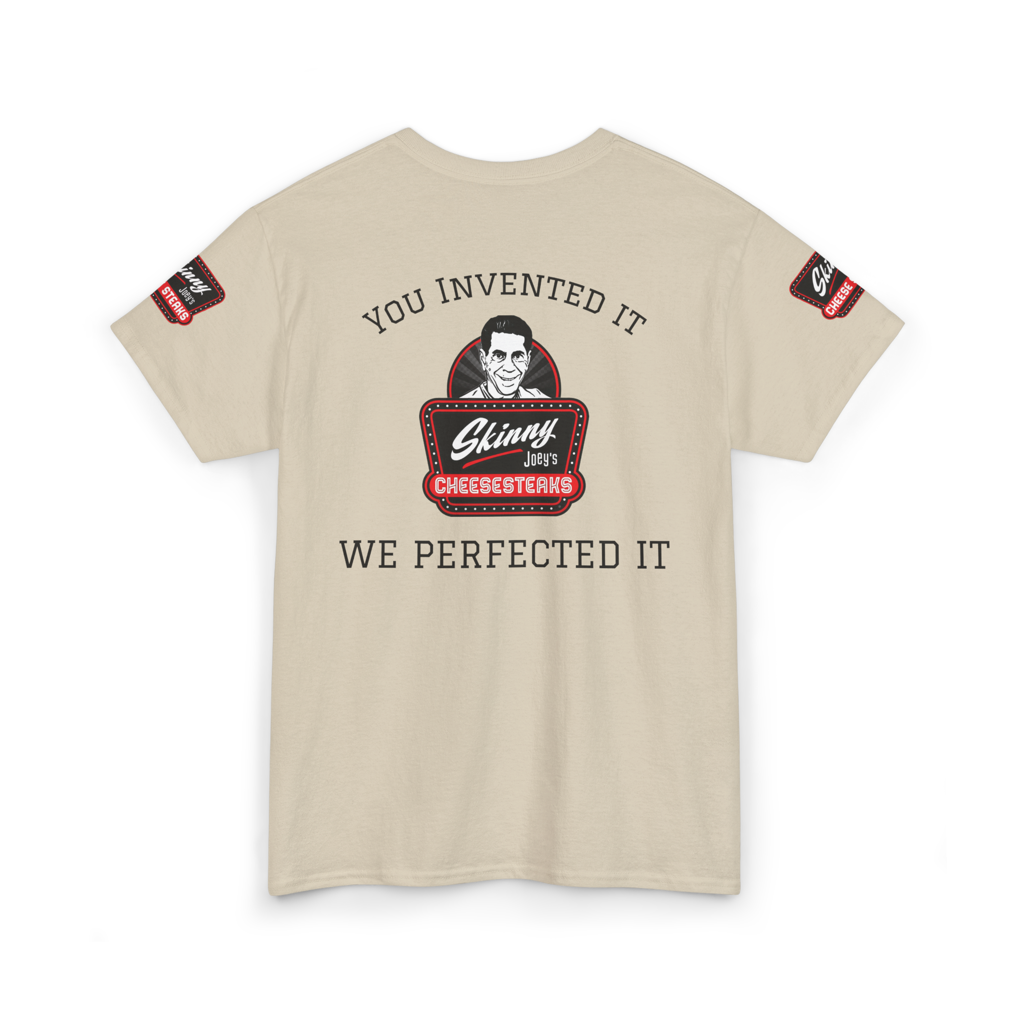 Beige t-shirt with graphic design and text on a white background