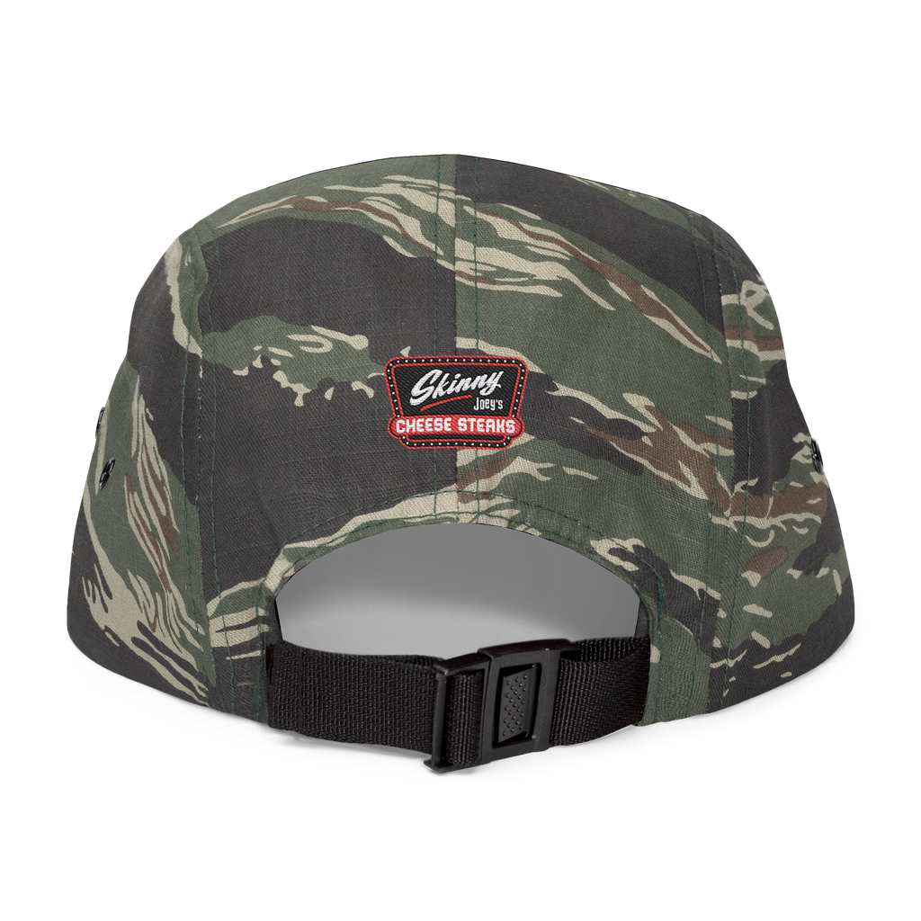 Camouflage cap with a visible brand logo on a white background