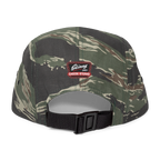Camouflage cap with a visible brand logo on a white background
