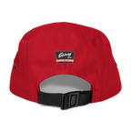 Red cap with a black strap and visible brand logo on a white background