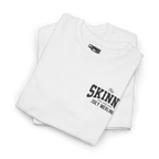 White t-shirt with 'The Skinn' logo on a white background