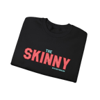 Folded black t-shirt with 'The Skinny' text on a white background