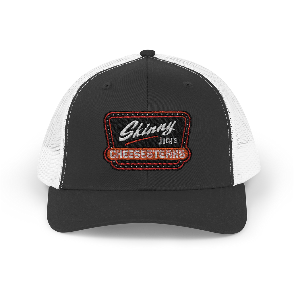 Black and white cap with 'Skinny Joey's Cheesesteaks' logo on a white background
