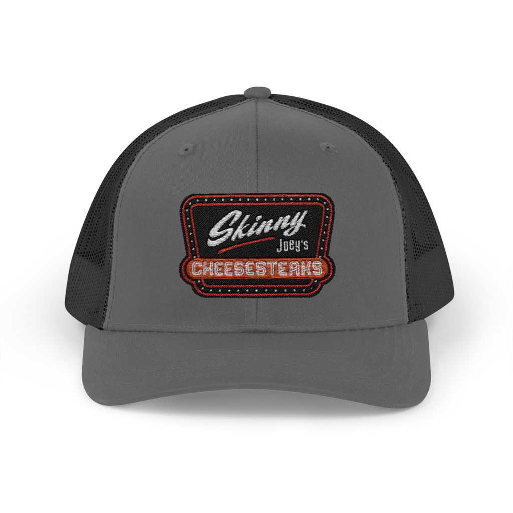 Gray trucker cap with a black mesh back and embroidered patch on a white background
