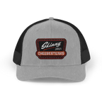 Gray and black trucker cap with 'Skinny Joey's Cheesesteaks' patch on a white background