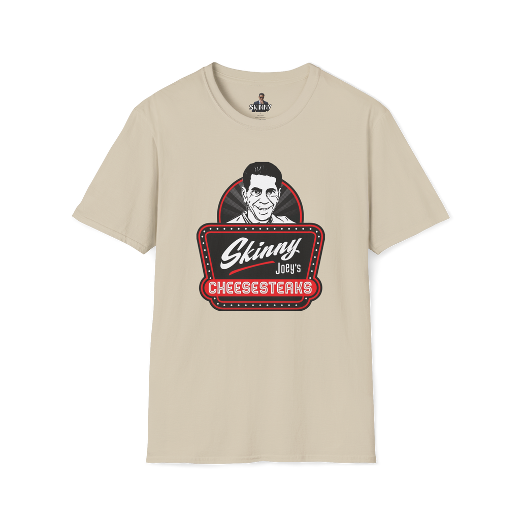 Beige t-shirt with 'Skinny Joey's Cheesesteaks' graphic on a white background