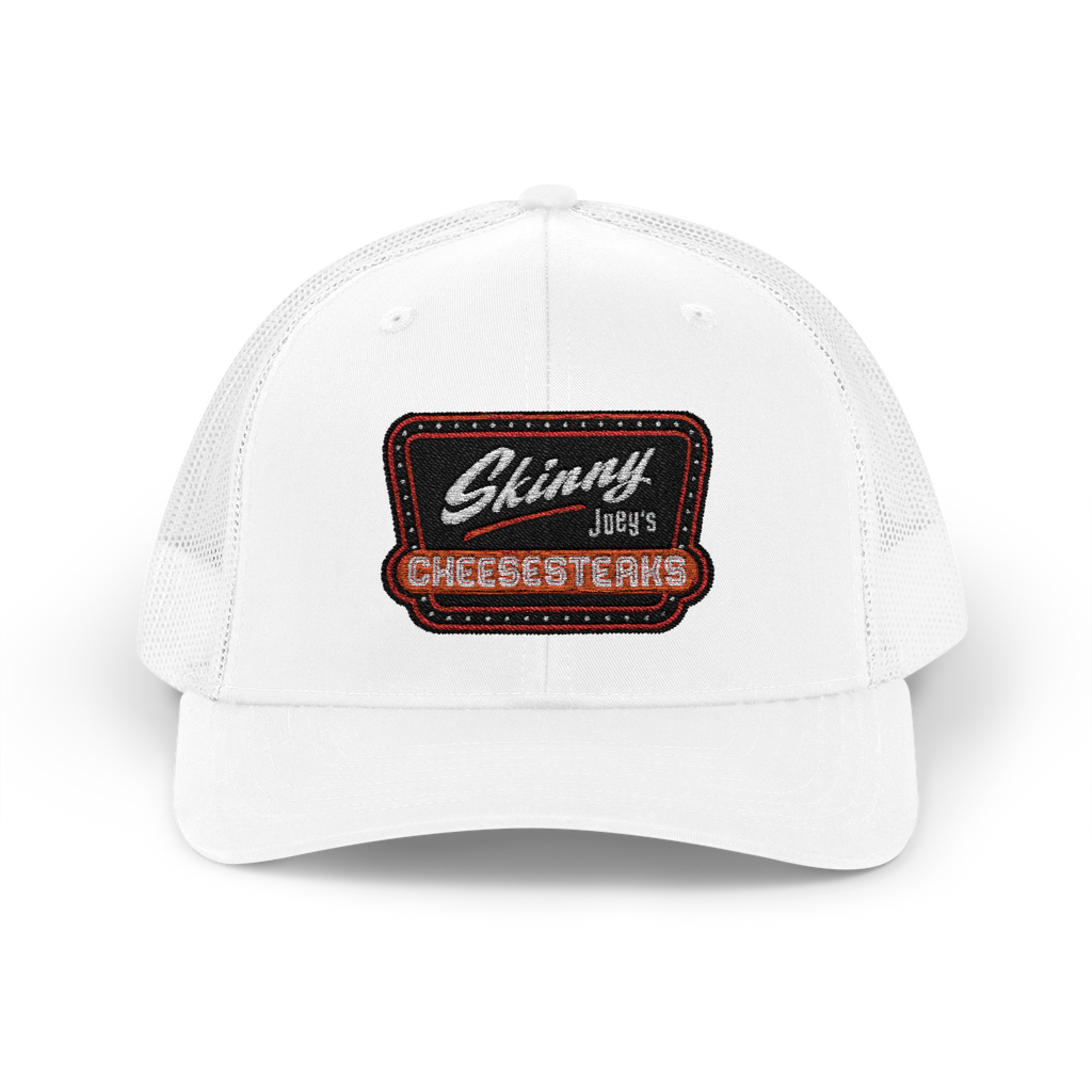 White cap with a patch reading 'Skinny Joey's Cheesesteaks' on a white background