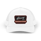 White cap with a patch reading 'Skinny Joey's Cheesesteaks' on a white background