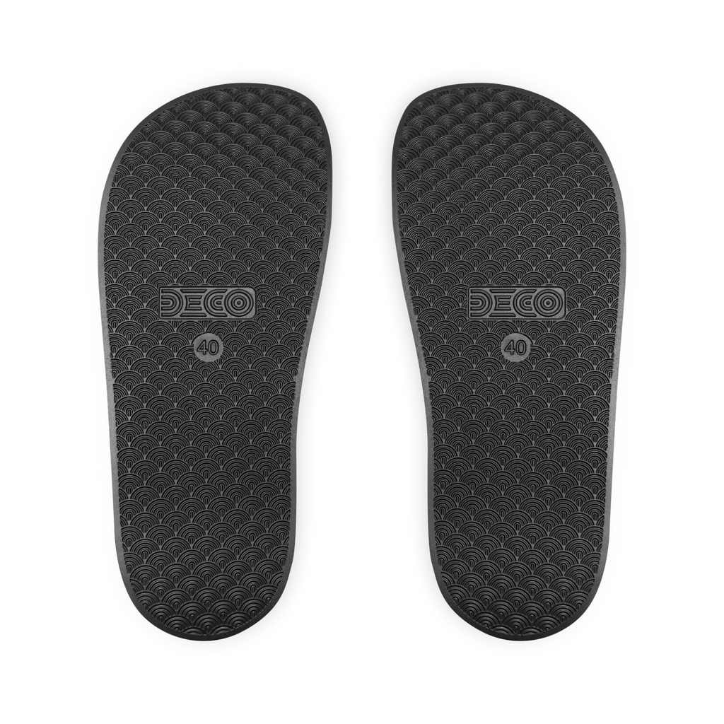 Pair of black shoe insoles with DECO branding on a white background