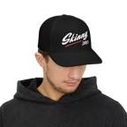 Man wearing a black cap with 'Skinny Joey's' logo on a white background