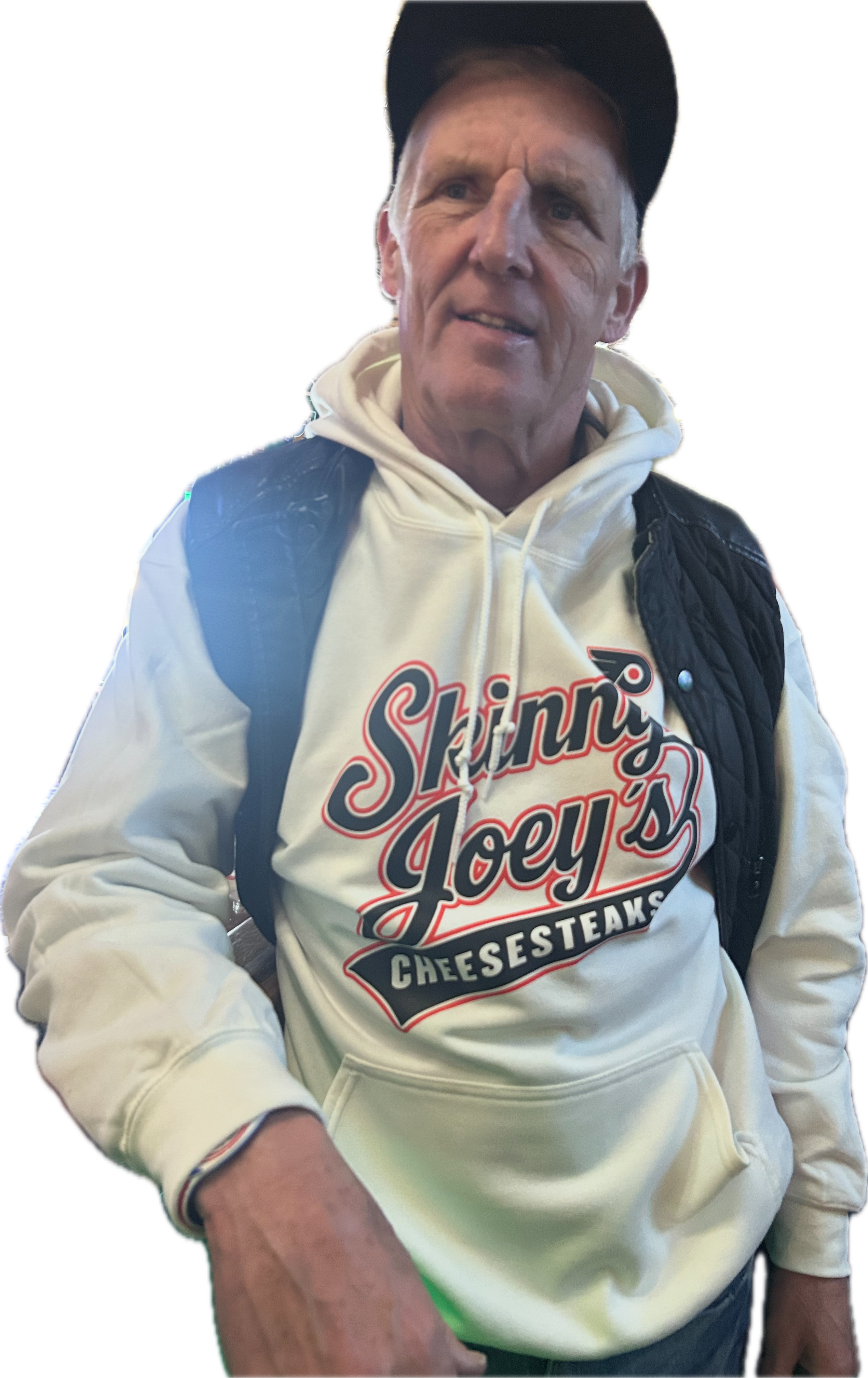 Man wearing a white hoodie with 'Skinny Joey's Cheesesteaks' text and graphics.