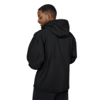 Person wearing a black hoodie from behind on a white background