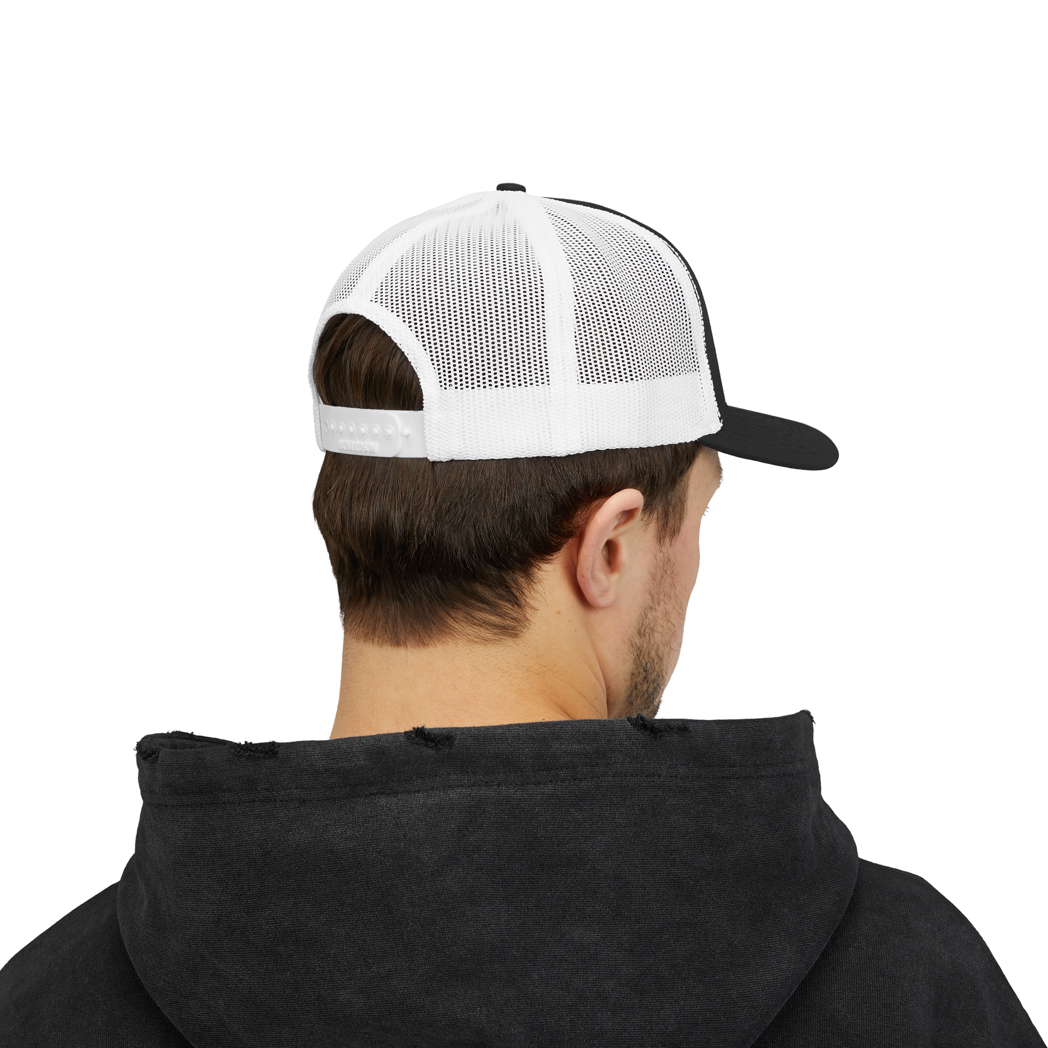Person wearing a black hoodie and white and black cap on a white background