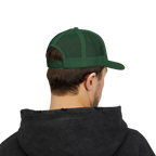Person wearing a green cap and black hoodie on a white background
