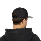 Person wearing a black and gray cap from behind on a white background