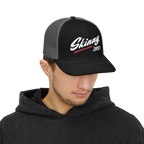 Person wearing a black and gray cap with 'Skinny Joey's' logo on a white background