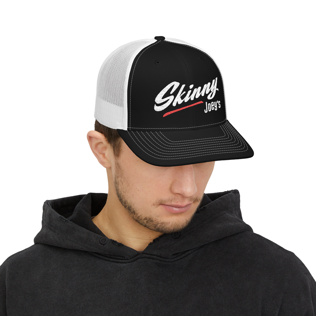 Person wearing a black and white cap with 'Skinny Joey's' logo on a white background