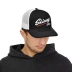 Person wearing a black and white cap with 'Skinny Joey's' logo on a white background