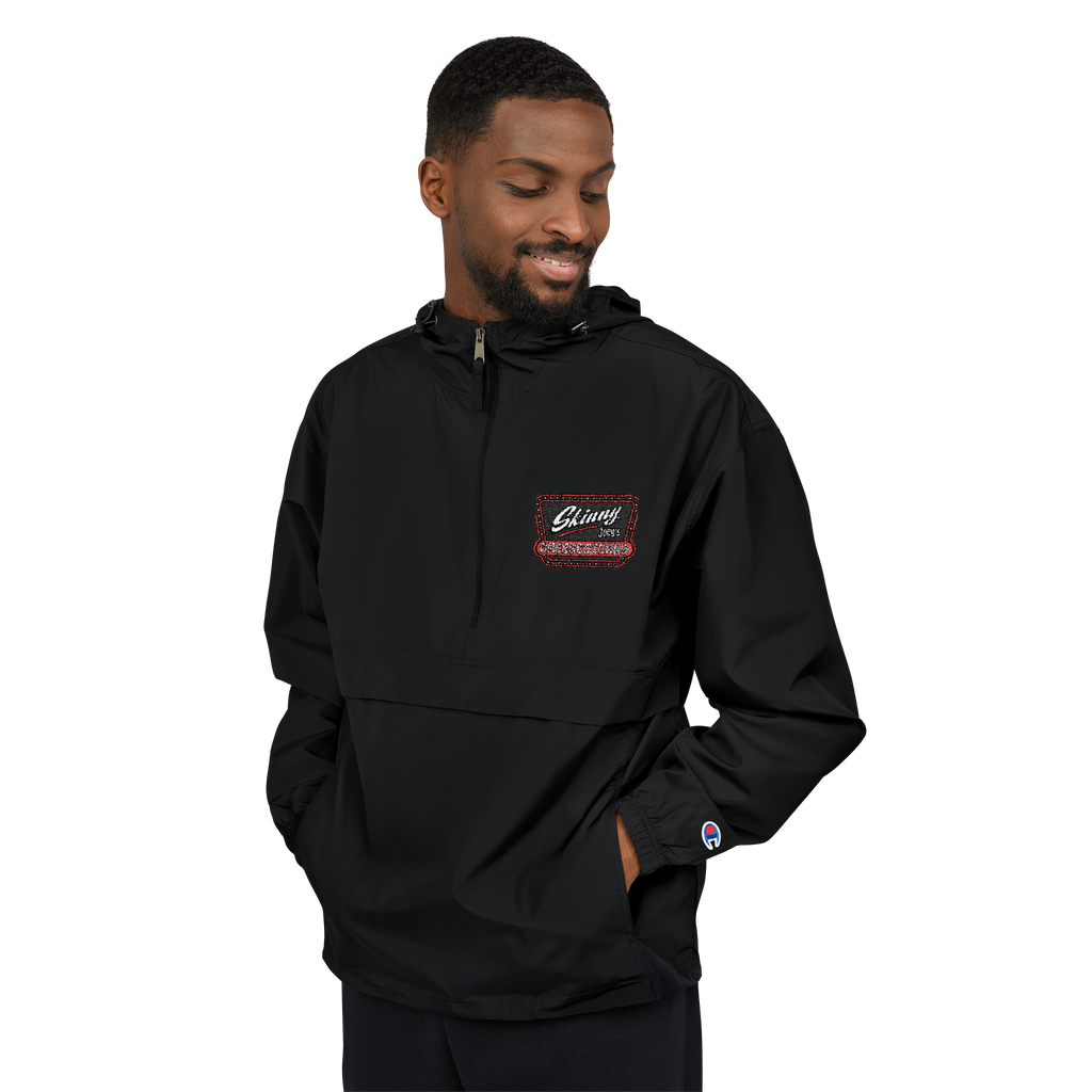 Man wearing a black pullover with a logo on a white background