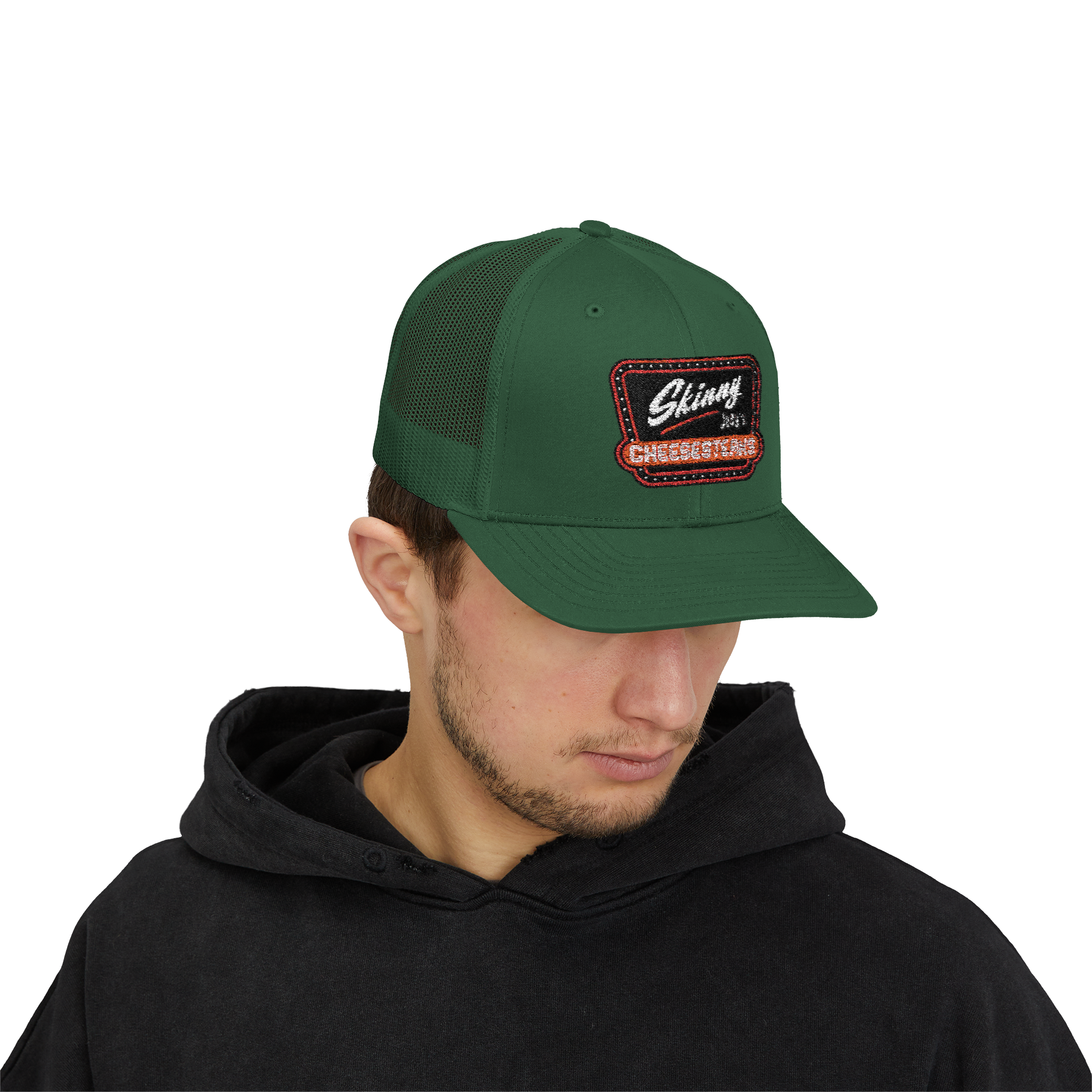 Person wearing a green cap with a patch on a white background