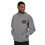 Man wearing a gray pullover with a brand logo on a white background