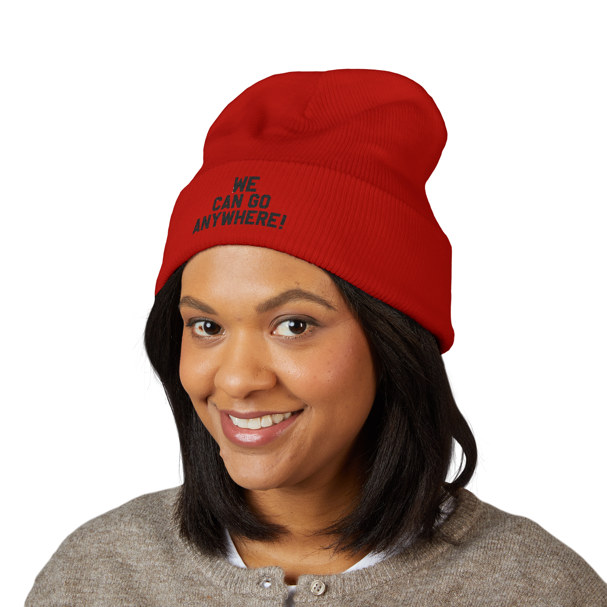 Person wearing a red beanie with 'WE CAN GO ANYWHERE!' text on a white background