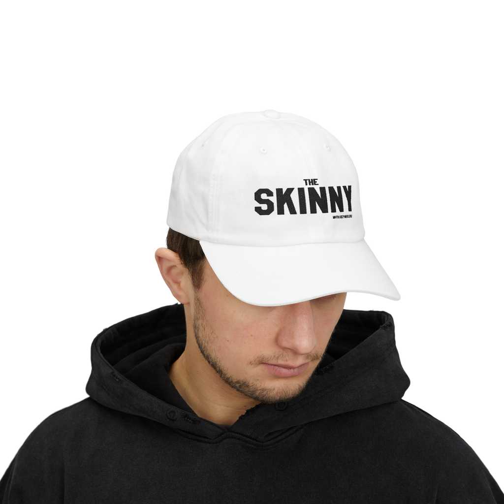 Person wearing a light blue cap with 'The Skinny' logo on a white background