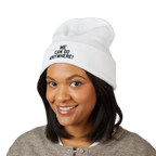 Person wearing a white beanie with 'WE CAN GO ANYWHERE!' text on a white background