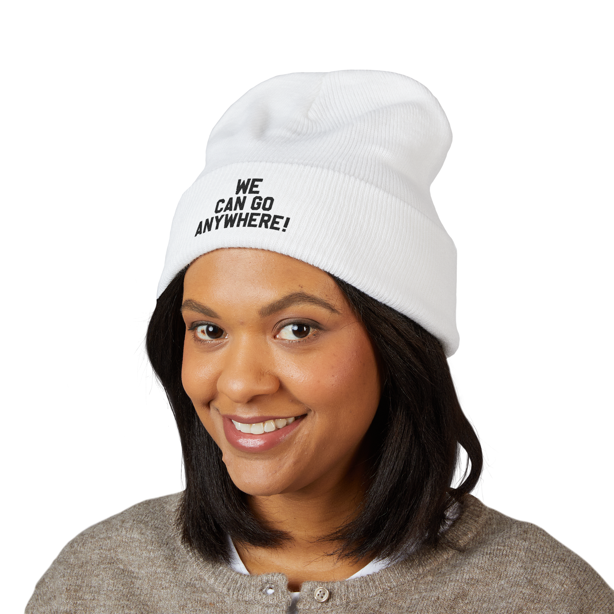 Person wearing a white beanie with 'WE CAN GO ANYWHERE!' text on a white background