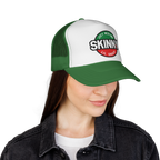 Person wearing a green and white cap with 'Skinny' logo on a white background