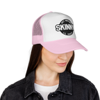 Person wearing a white and pink cap with 'Skinny Lil Snout' logo on a white background