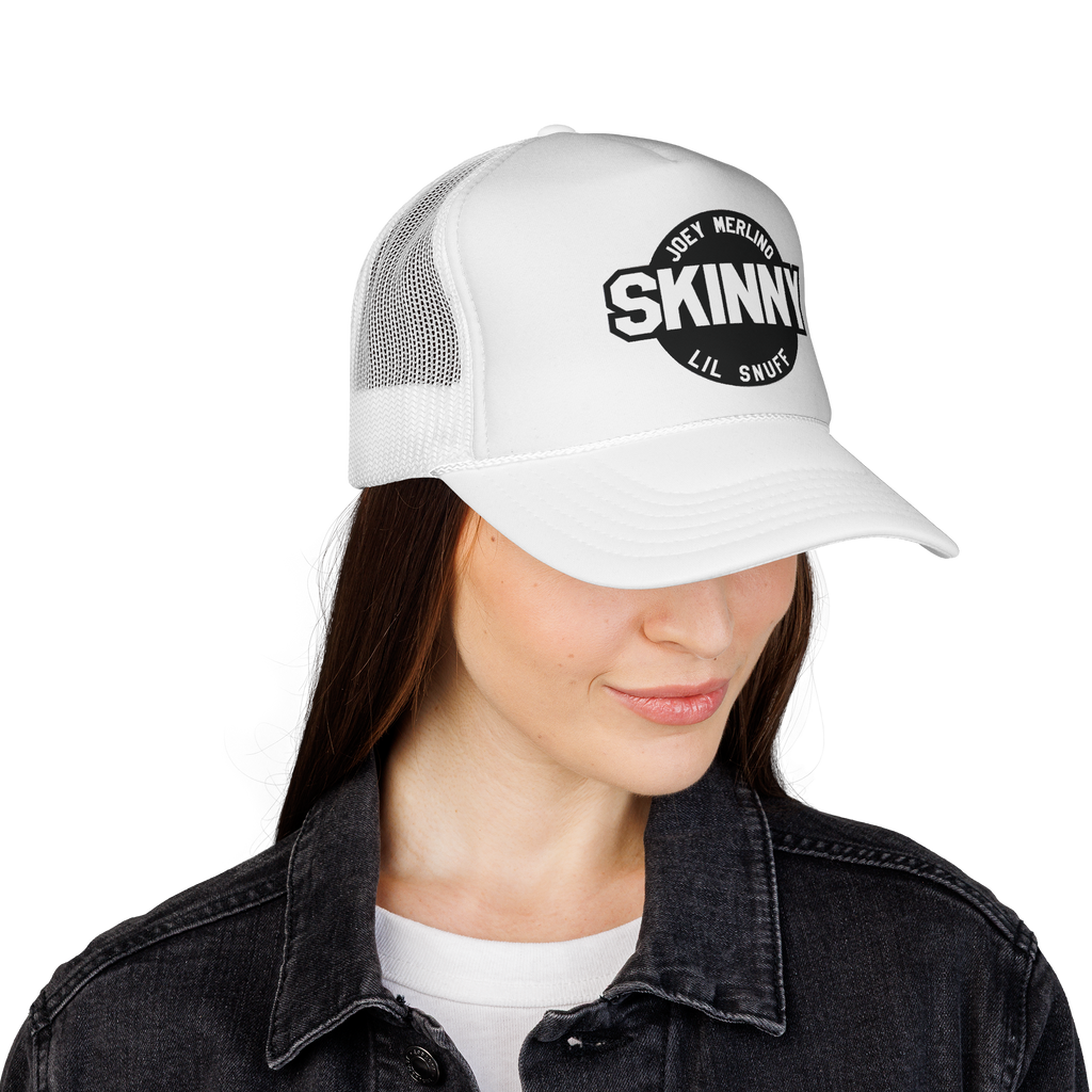 Person wearing a white cap with 'Skinny' logo on a white background