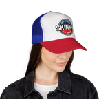Person wearing a white, blue, and red cap with 'Skinny Lil' Swift' logo on a white background