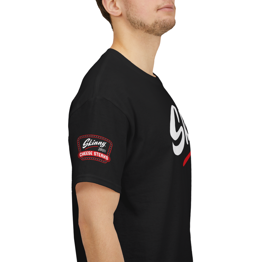 Person wearing a black t-shirt with a logo on the sleeve against a white background