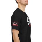 Person wearing a black t-shirt with a logo on the sleeve against a white background