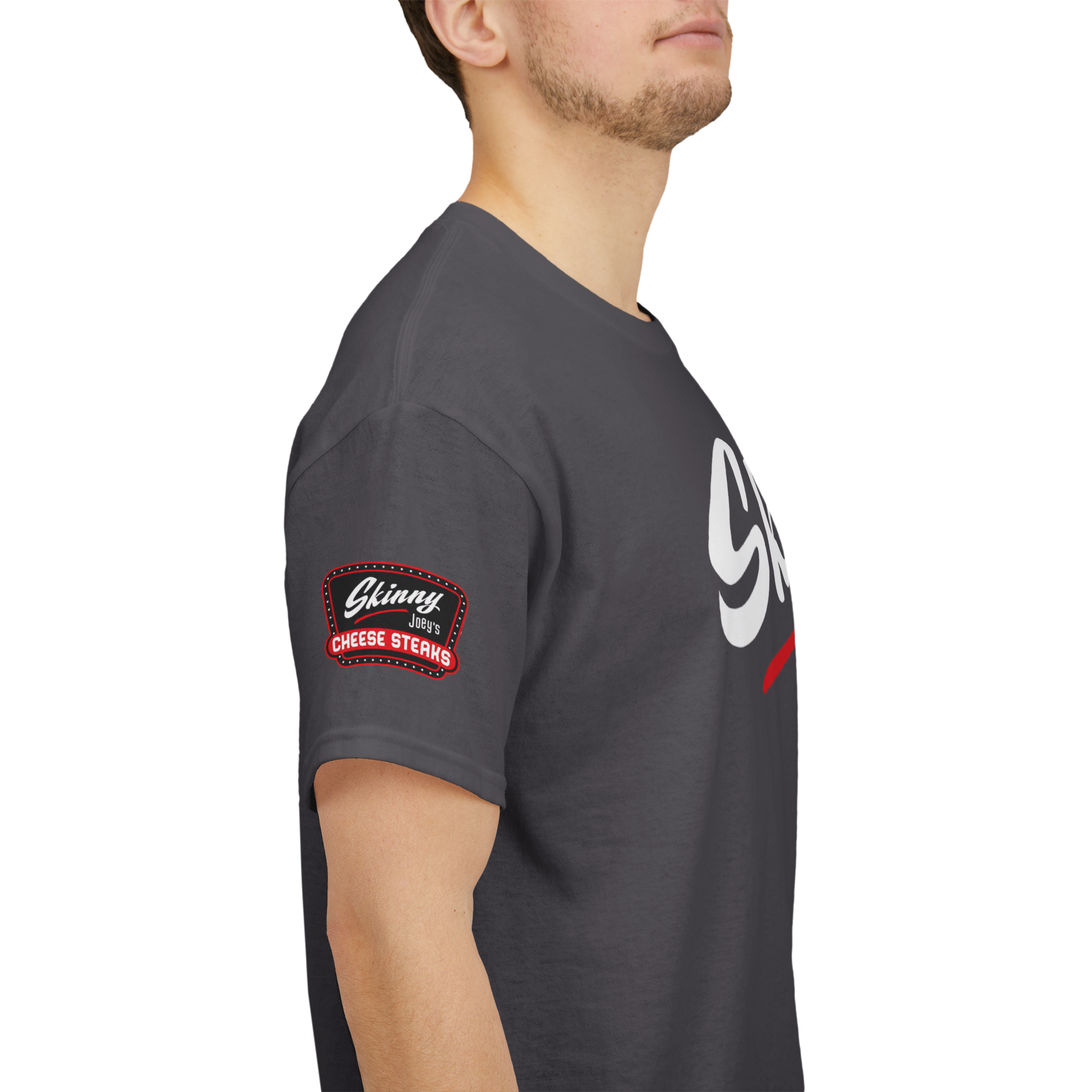 Person wearing a dark gray t-shirt with a logo on the sleeve against a white background