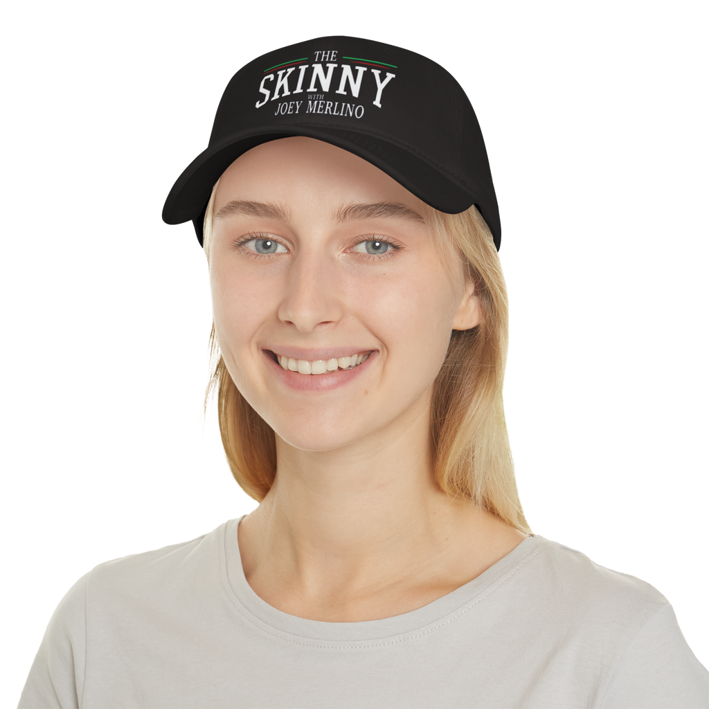 Person wearing a black cap with 'The Skinny' text on a white background