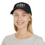 Person wearing a black cap with 'The Skinny' text on a white background